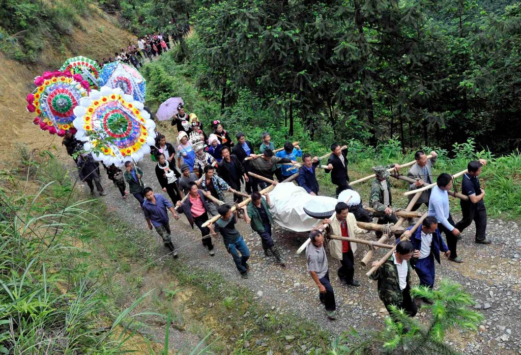 A funeral procession in China. The son was following a ritual called “pressing the ghost’s bed”. Photo: Reuters