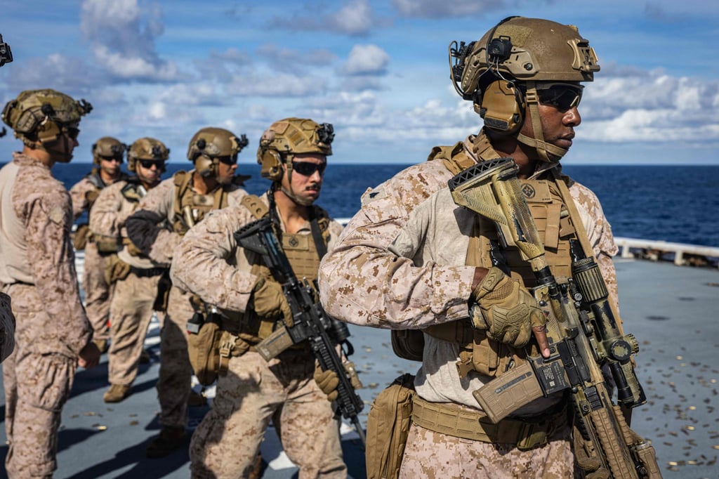 US Marines prepare to engage targets during a deck shoot last month in the Caribbean Sea. Photo: AFP US Marines prepare to engage targets during a deck shoot last month in the Caribbean Sea. Photo: AFP