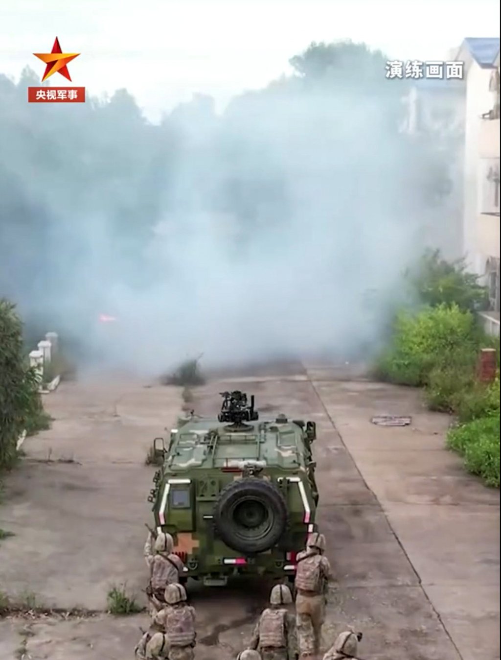 PLA troops were shown moving into an area of concrete ruins in a light protected tactical vehicle. Photo: Handout