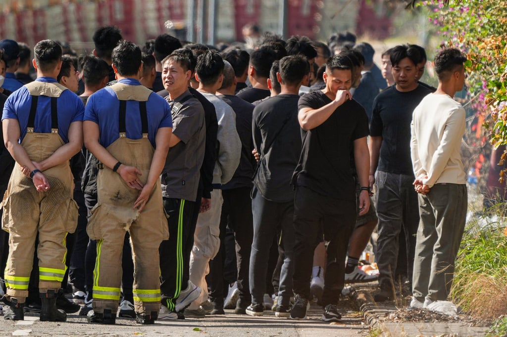 A roadside memorial ceremony for fallen firefighter Ho Wai-ho is held outside Wang Cheong House on Tuesday afternoon. Photo: Eugene Lee