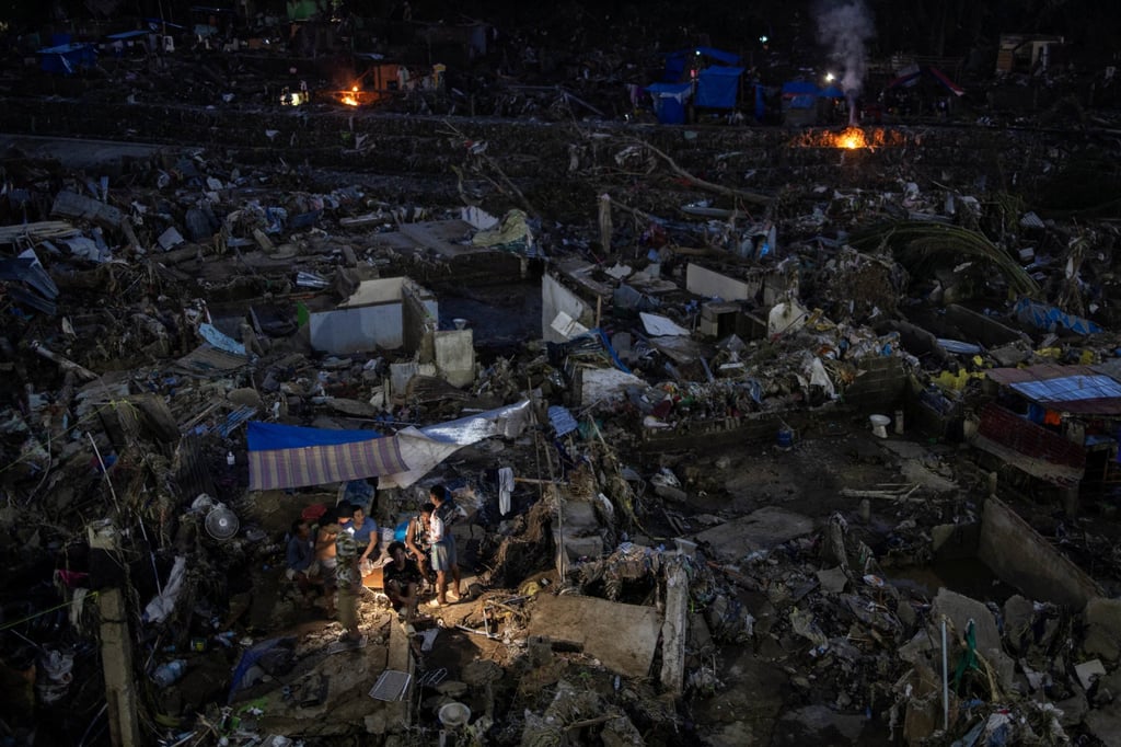 People shelter under makeshift tents amid the remains of homes swept away by floods brought on by Typhoon Kalmaegi in Cebu, the Philippines, on November 6. Photo: Reuters