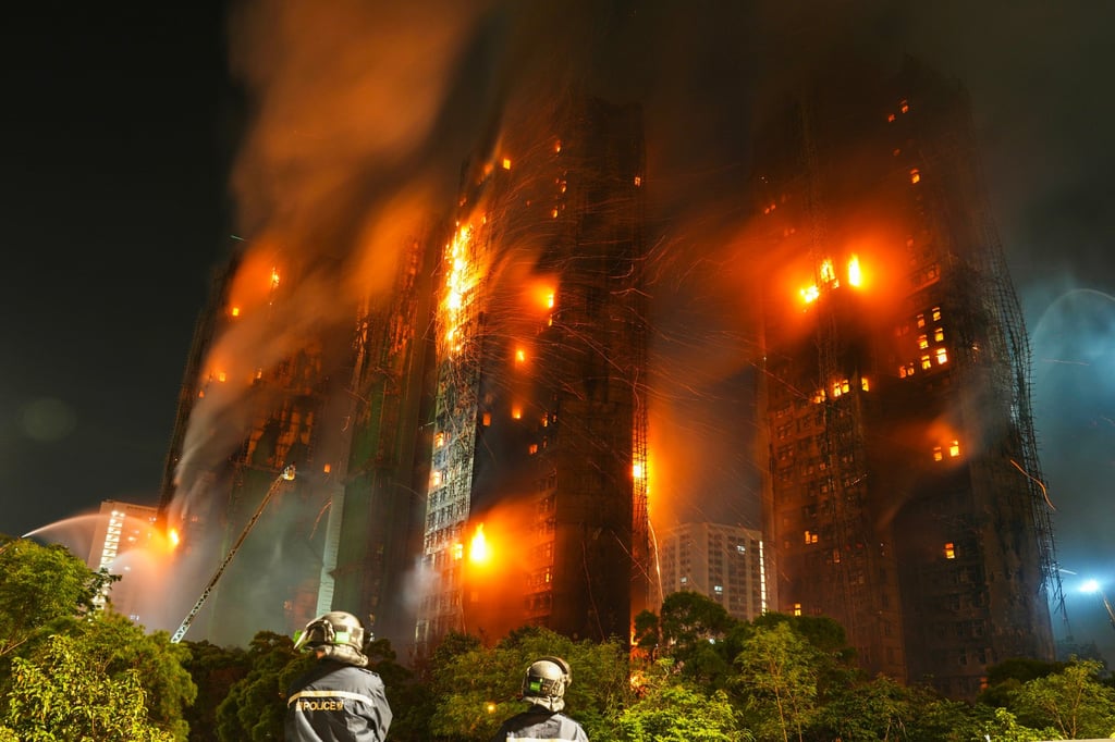 Firefighters tackle the flames in the earlier hours of November 27. Photo: Karma Lo