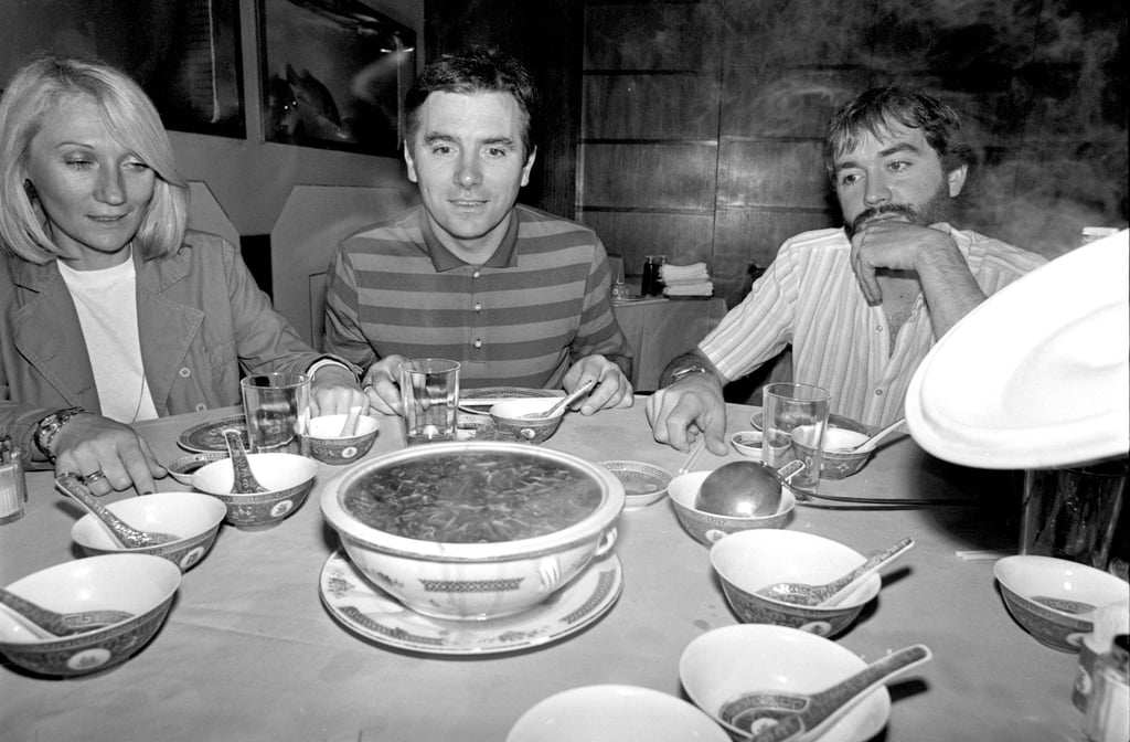 Westerners prepare to taste snake soup at a restaurant on Sai Yeung Choi Street, Mong Kok, in 1982. Photo: SCMP Archives