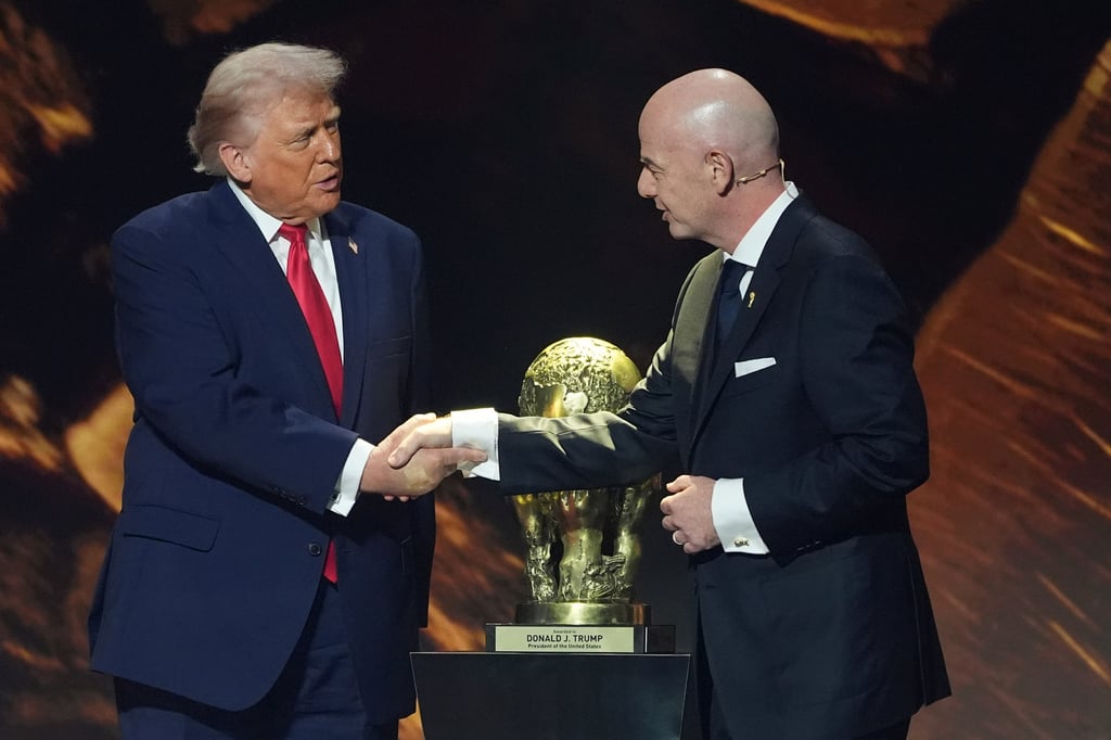 US President Donald Trump shakes hands with Fifa President Gianni Infantino as he is presented with the inaugural Fifa Peace Prize at the Kennedy Centre on Friday. Photo: AP
