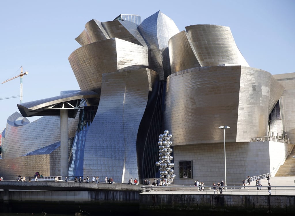 People walk around the Guggenheim Museum in Bilbao, Spain, in April 2017. Photo: EPA-EFE