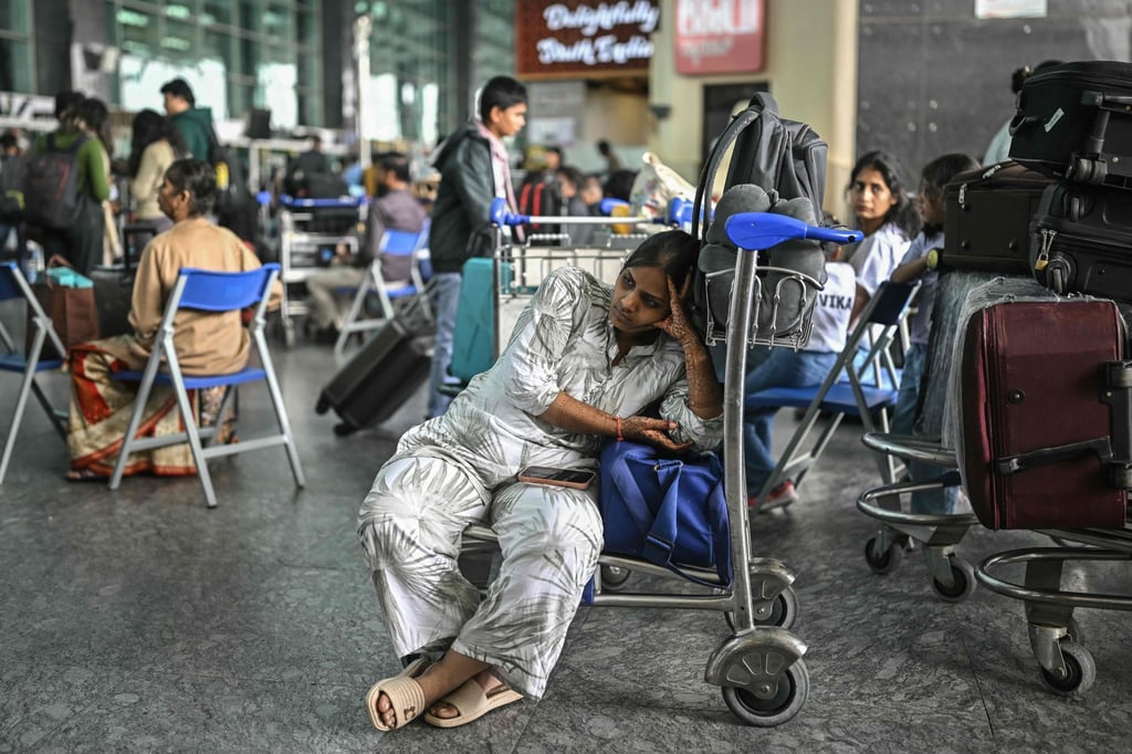 A passenger waits outside the IndiGo Airlines kiosk at the Kempegowda International Airport in Bengaluru on Saturday, as the IndiGo crisis enters a fifth day. Photo: AFP A passenger waits outside the IndiGo Airlines kiosk at the Kempegowda International Airport in Bengaluru on Saturday, as the IndiGo crisis enters a fifth day. Photo: AFP