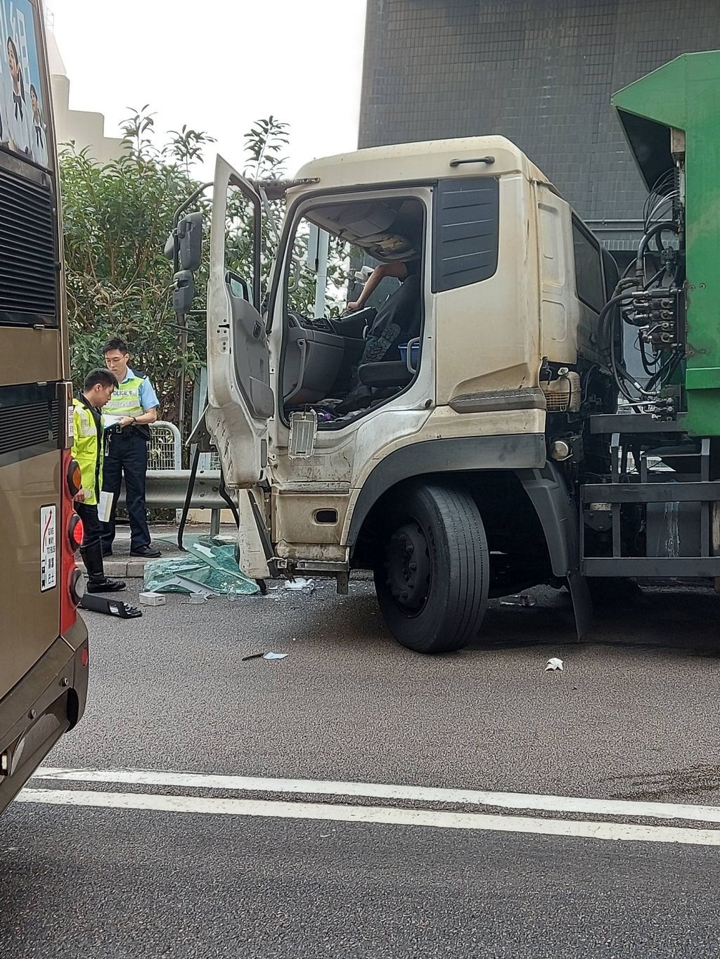 The driver of the rubbish truck has been taken to Yan Chai Hospital in Tsuen Wan for treatment. Photo: Handout The driver of the rubbish truck has been taken to Yan Chai Hospital in Tsuen Wan for treatment. Photo: Handout