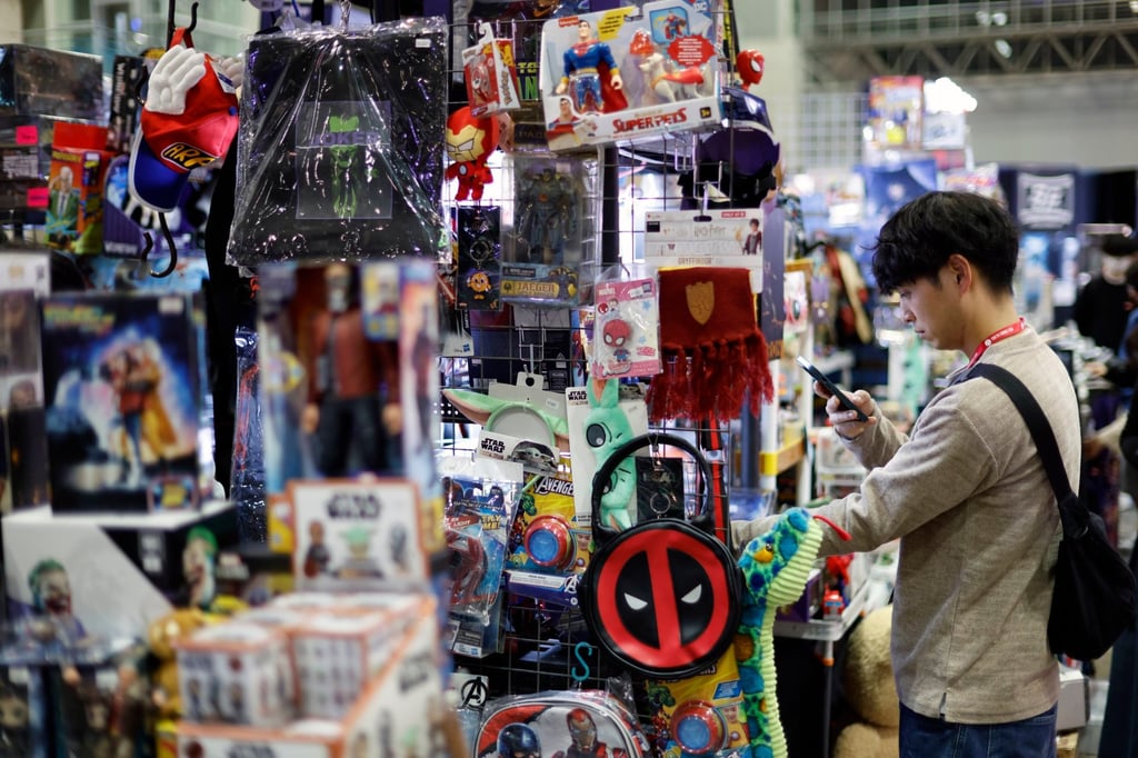 A visitor looks at products on sale at the Tokyo Comic Con 2025 in Chiba on Friday. As part of its “Cool Japan” strategy, Japan’s government has grand ambitions for anime, manga and games. Photo: EPA A visitor looks at products on sale at the Tokyo Comic Con 2025 in Chiba on Friday. As part of its “Cool Japan” strategy, Japan’s government has grand ambitions for anime, manga and games. Photo: EPA