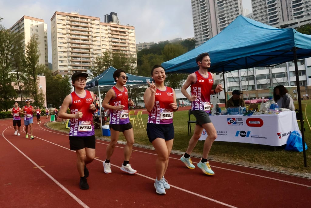 Lap Dog Challenge participants on the running track in Sandy Bay. Photo: Jonathan Wong Lap Dog Challenge participants on the running track in Sandy Bay. Photo: Jonathan Wong