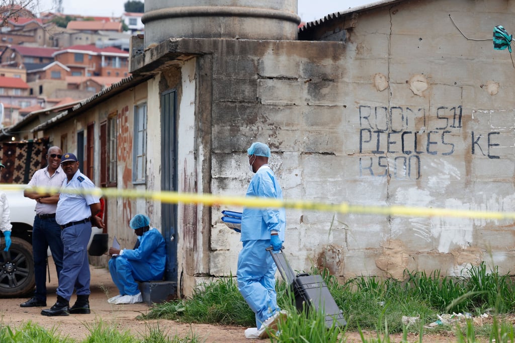 A police forensics member arrives at the scene of a mass shooting near Pretoria, South Africa, on Saturday. Photo: Reuters
