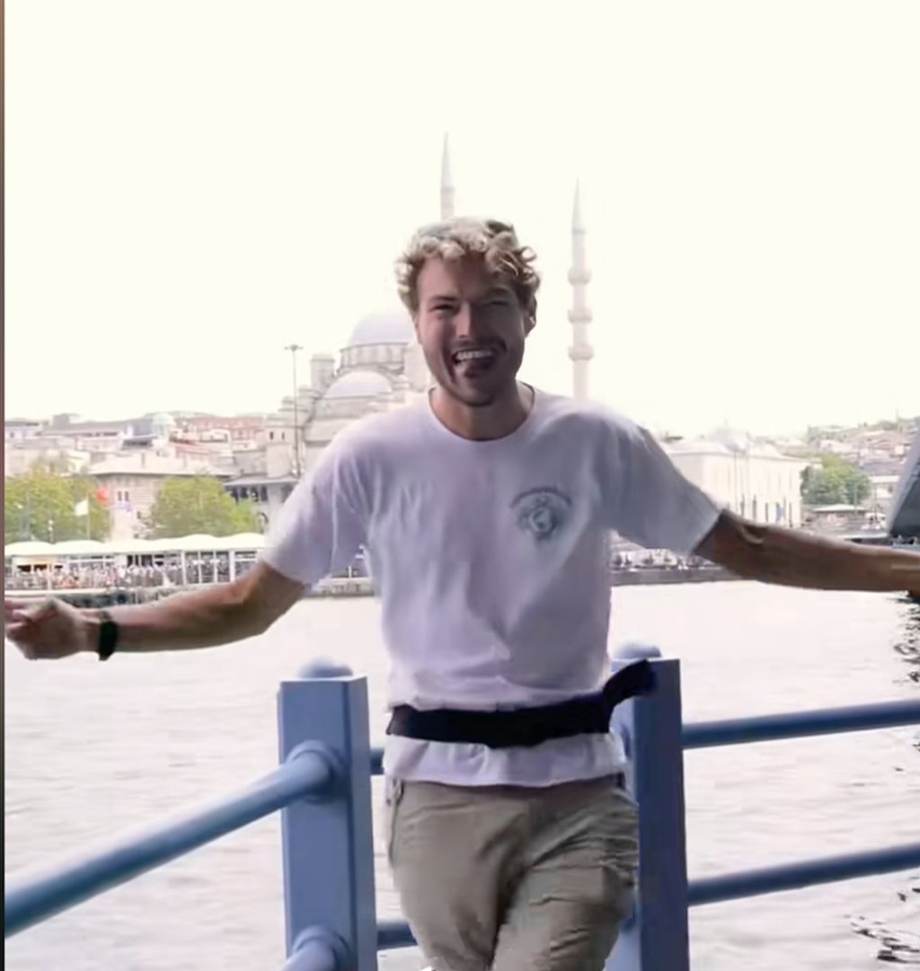 Le Guyader in a happy mood during one of the many stops on his 18,000 kilometre adventure. Photo: Douyin