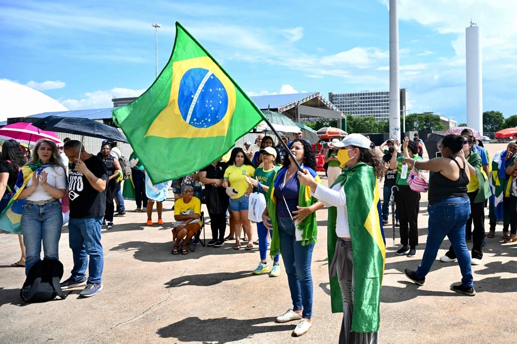 Supporters of Brazil’s former president Jair Bolsonaro protest against his arrest in Brasilia on November 30. Photo: AFP