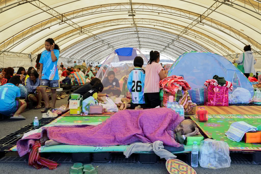 People rest at a shelter in Thailand’s Buriram province on Monday following fresh military clashes between Thailand and Cambodia along parts of their disputed border. Photo: Reuters People rest at a shelter in Thailand’s Buriram province on Monday following fresh military clashes between Thailand and Cambodia along parts of their disputed border. Photo: Reuters