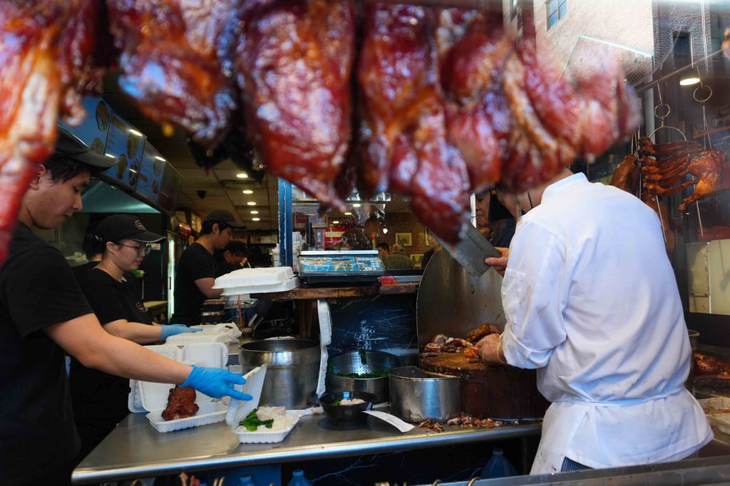 Roast meats hang in the window of a restaurant in Boston Chinatown. Photo: Hei-kiu Au Roast meats hang in the window of a restaurant in Boston Chinatown. Photo: Hei-kiu Au