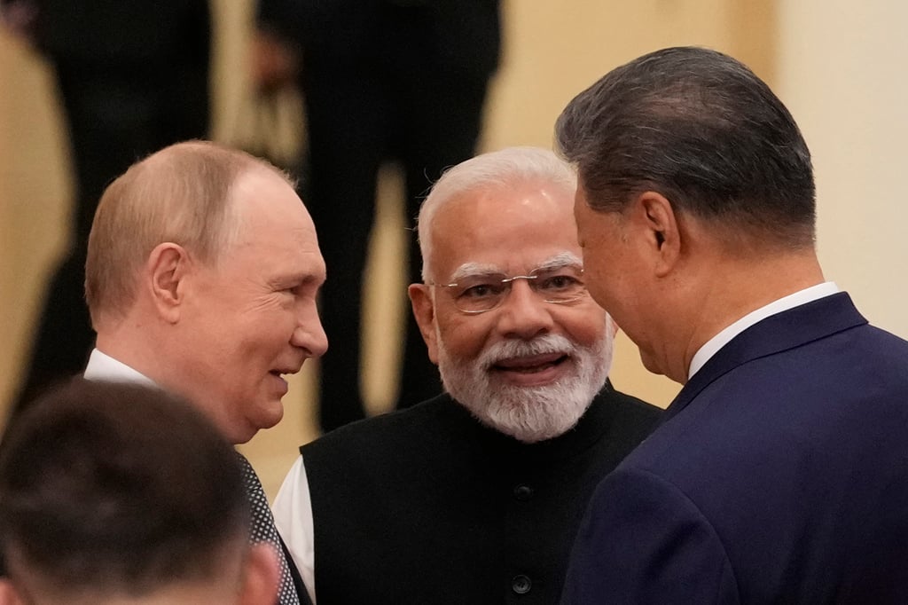 Indian Prime Minister Narendra Modi speaks with Russian President Vladimir Putin and President Xi Jinping ahead of the Shanghai Cooperation Organisation summit in Tianjin on September 1. Photo: TNS Indian Prime Minister Narendra Modi speaks with Russian President Vladimir Putin and President Xi Jinping ahead of the Shanghai Cooperation Organisation summit in Tianjin on September 1. Photo: TNS