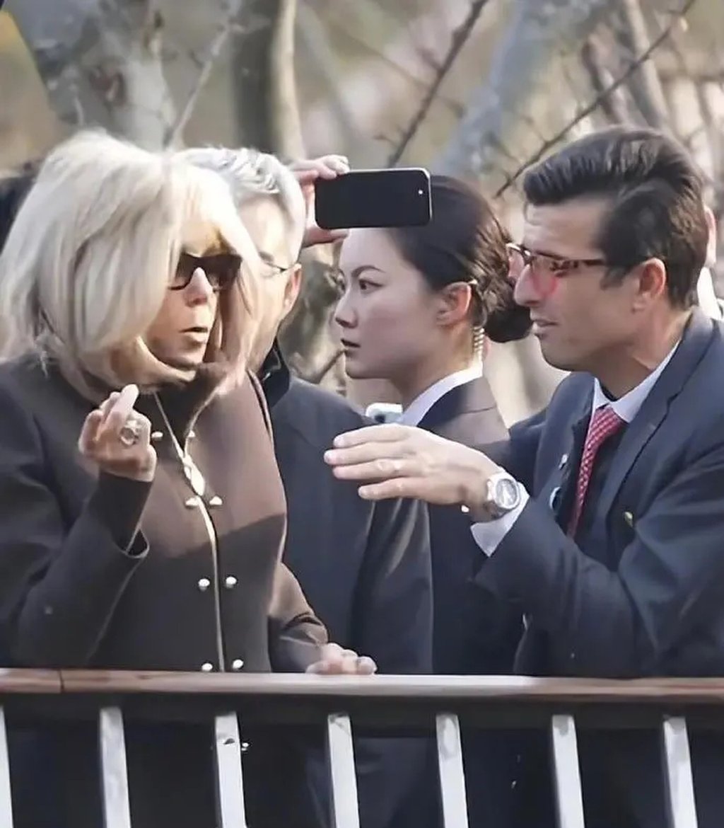 While Brigitte Macron, left, attended public events in Beijing and Chengdu, Yan, middle, was captured on film maintaining an alert demeanour, her eyes continually scanning the surroundings for potential threats. Photo: Weibo While Brigitte Macron, left, attended public events in Beijing and Chengdu, Yan, middle, was captured on film maintaining an alert demeanour, her eyes continually scanning the surroundings for potential threats. Photo: Weibo