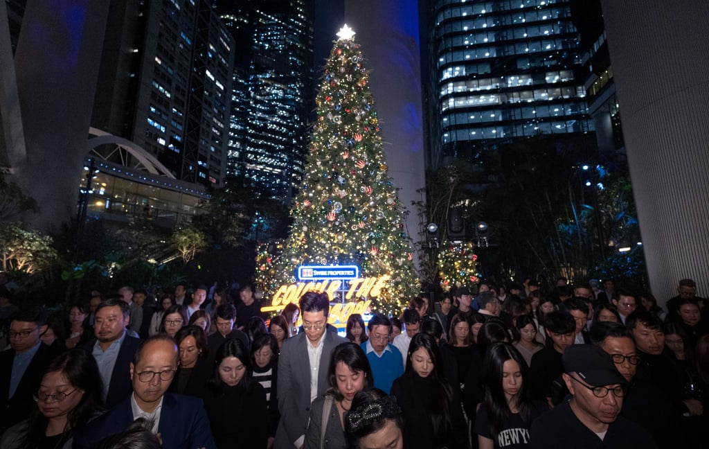 A moment of silence is observed for the victims of the Tai Po fire. Photo: Dickson Lee A moment of silence is observed for the victims of the Tai Po fire. Photo: Dickson Lee