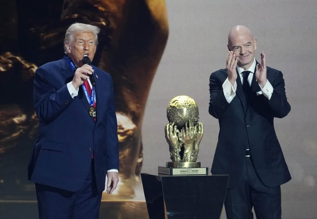 Fifa president Gianni Infantino awards US President Donald Trump the Fifa Peace Prize at last week’s World Cup draw. Photo: Kyodo