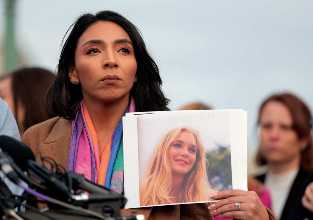 Amanda Roberts, sister-in-law of Virginia Giuffre, holds up a photo of Giuffre during a news conference with US lawmakers in Washington in November. Photo: AFP Amanda Roberts, sister-in-law of Virginia Giuffre, holds up a photo of Giuffre during a news conference with US lawmakers in Washington in November. Photo: AFP