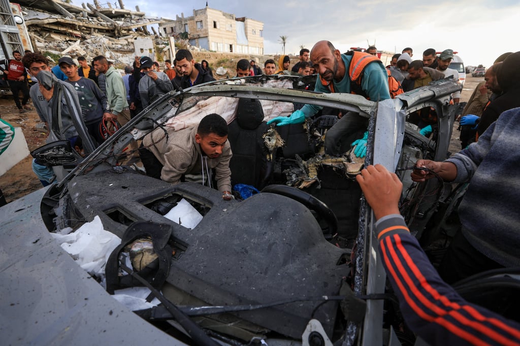 Palestinians inspect the site of an Israeli strike on a car in Gaza on Saturday. Photo: Reuters Palestinians inspect the site of an Israeli strike on a car in Gaza on Saturday. Photo: Reuters