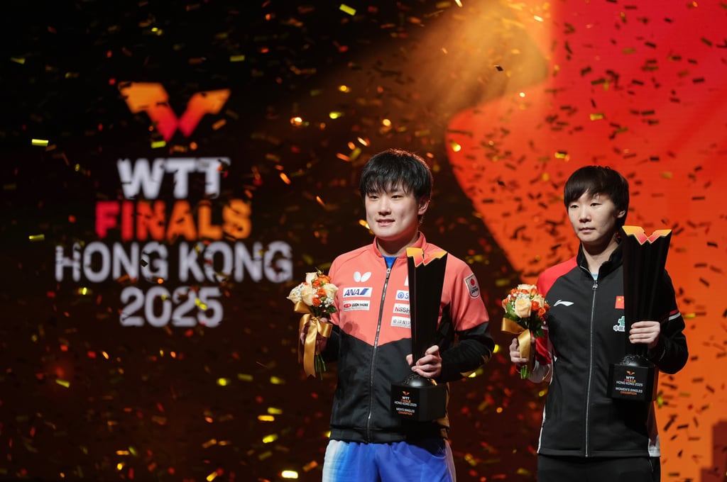 Tomokazu Harimoto, the first non-Chinese men’s champion, with women’s winner Wang Manyu. Photo: Eugene Lee