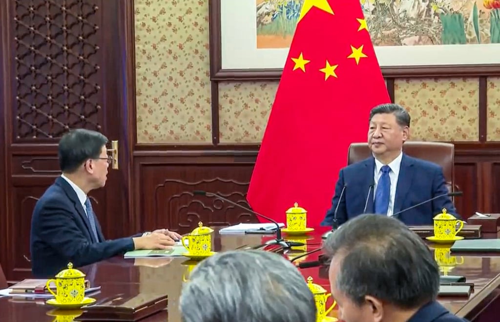 Chief Executive John Lee (left) is on an annual three-day duty visit to Beijing to update central leaders, including President Xi Jinping (right) on the work of the Hong Kong government. Photo: RTHK