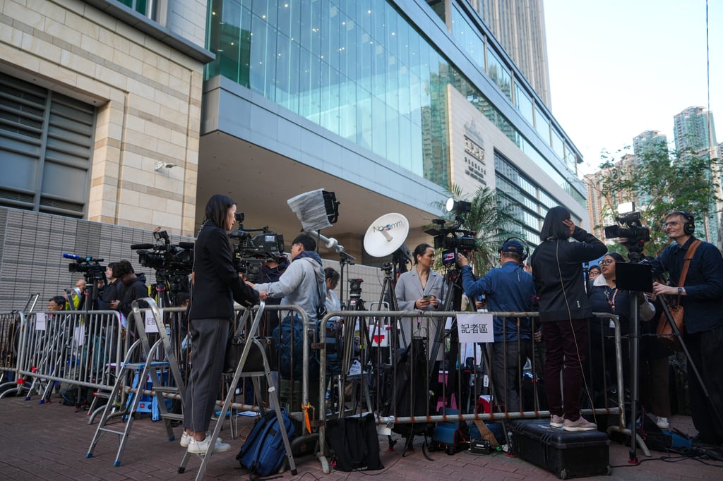 Media representatives gather outside West Kowloon Court on Monday, ahead of the hearing announcing the verdict on Jimmy Lai. Photo: Sam Tsang