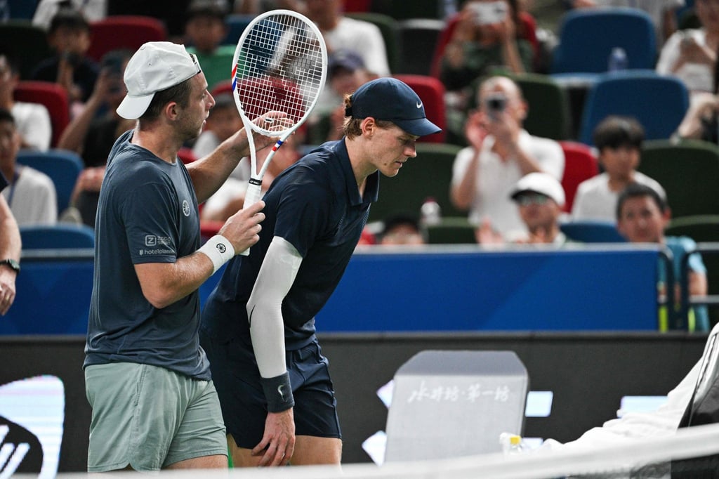 Jannik Sinner retires from his match with Tallon Griekspoor (left) at the Shanghai Masters. Photo: AFP