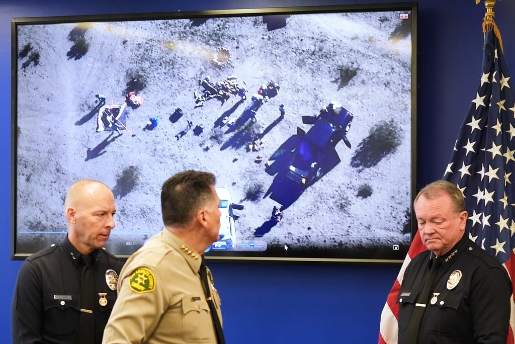 Officials play surveillance footage at Monday’s press conference. Photo: AP