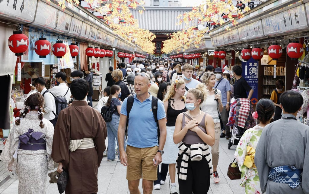 People walk along Nakamise shopping street in Tokyo’s Asakusa area. Photo: Kyodo