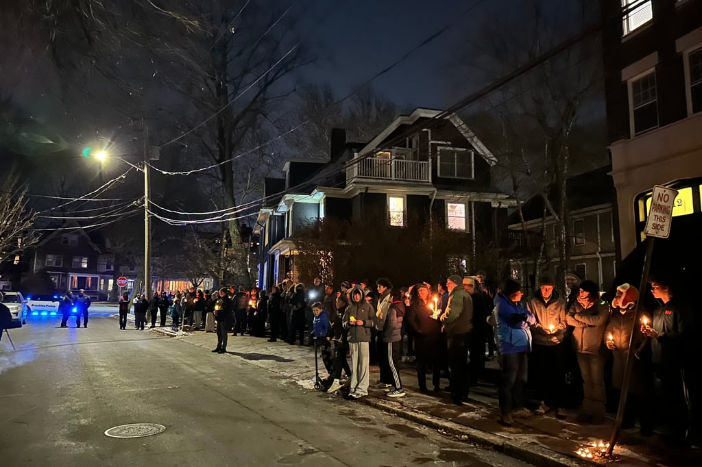 A crowd outside Nuno Loureiro’s home. Photo: AP