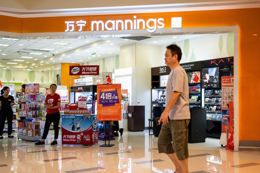 A pedestrian walks past a Mannings store in Shenzhen. Photo: SOPA Images/LightRocket via Getty Images