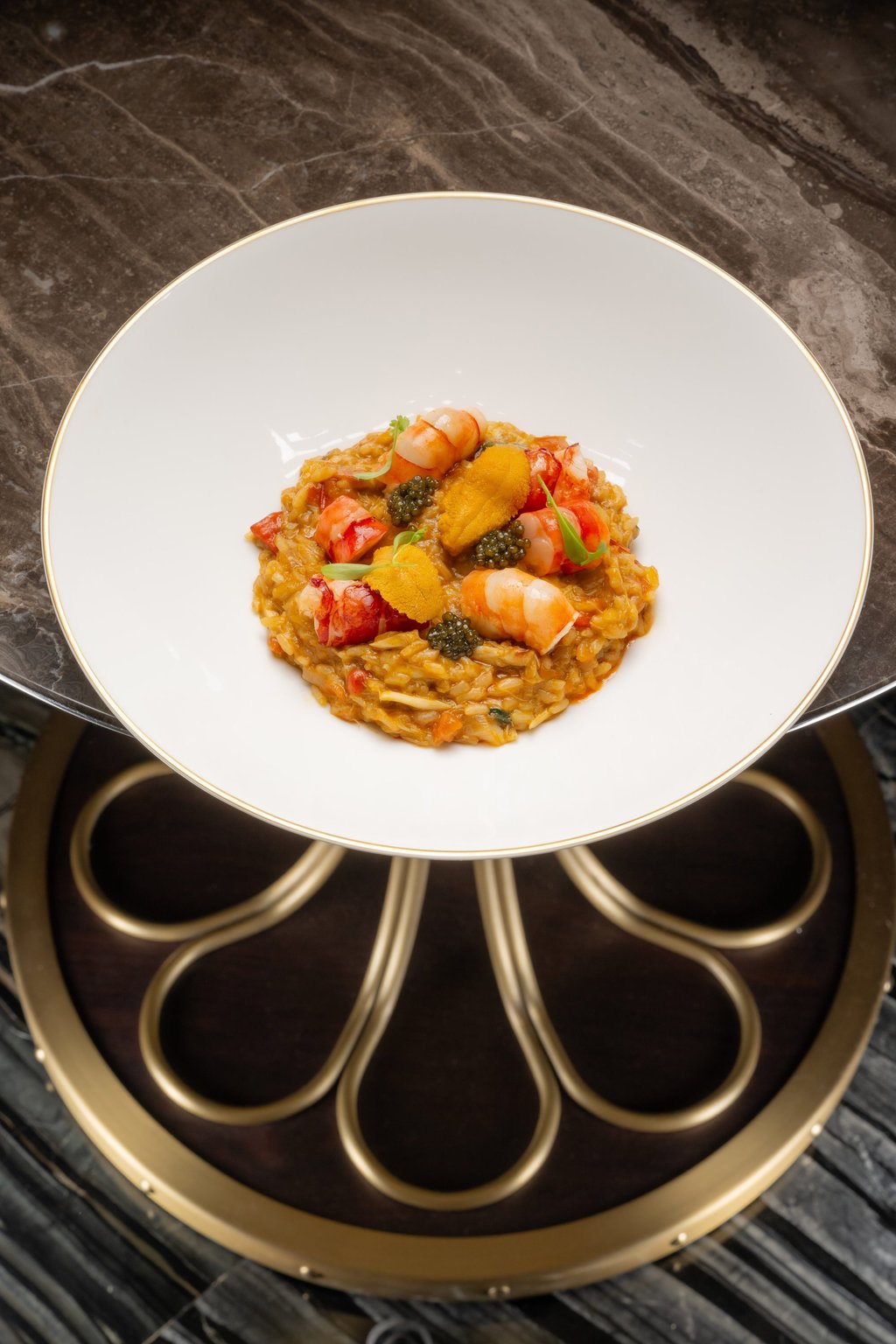 One of the signature dishes at Mesa by José Avillez is seafood rice and caviar, which is an elevated version of the classic Portuguese dish arroz de marisco.