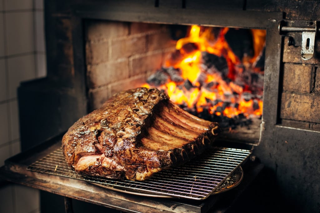 A wood-fired 75-day dry-aged Wagyu joint comes out of the oven at Burnt Ends in Singapore. Photo: Simon Pynt