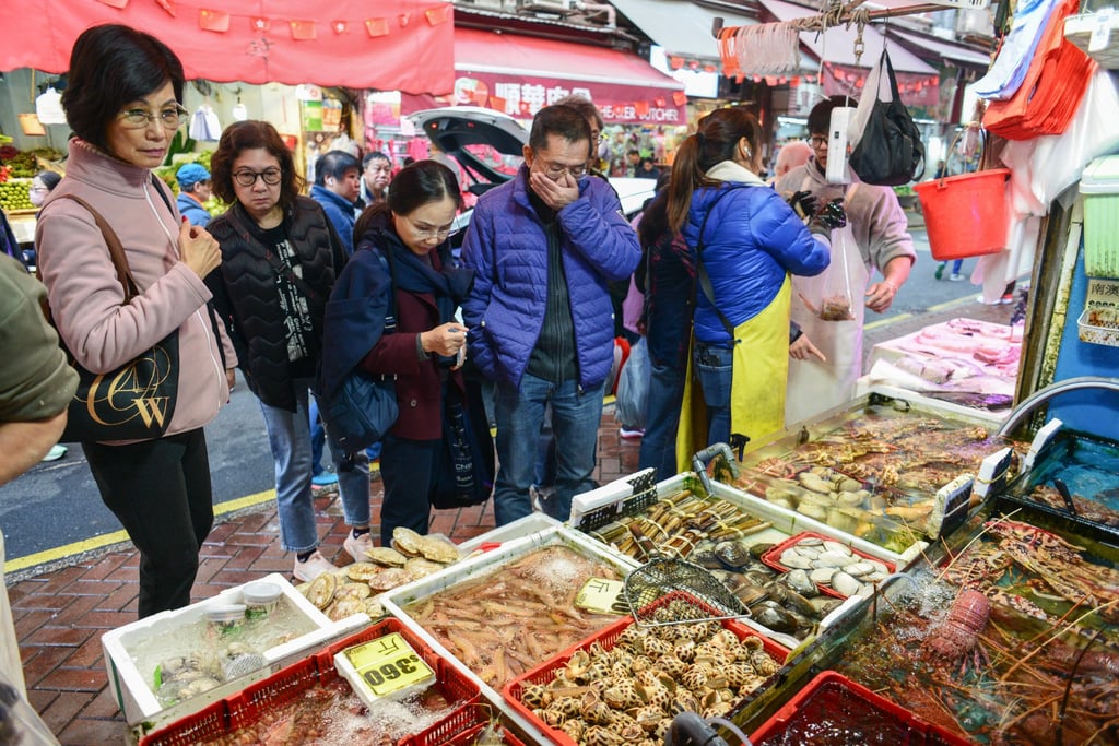 People buy seafood at Hong Kong’s Bowrington Road Market in preparation for the winter solstice in 2024. Photo: Antony Dickson People buy seafood at Hong Kong’s Bowrington Road Market in preparation for the winter solstice in 2024. Photo: Antony Dickson