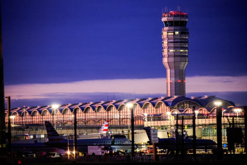 The air traffic control tower and American Airlines planes are pictured at the Ronald Reagan Washington National Airport, just days after the collision of a jet and a military helicopter. Photo: Reuters