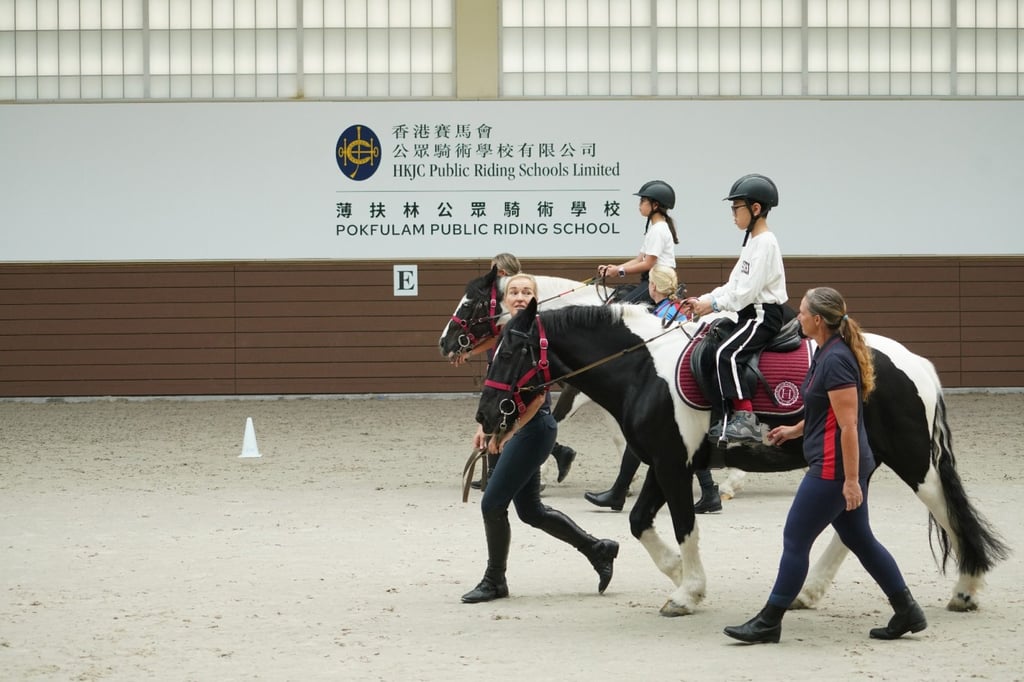 Students ride horses guided by instructors from the Riding for the Disabled Association at the Pokfulam Public Riding School. Photo: RDA