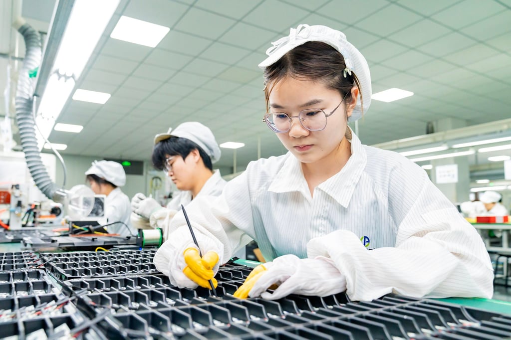 Workers make lithium batteries for domestic and international clients in a factory in Jiangsu. Photo: Getty Workers make lithium batteries for domestic and international clients in a factory in Jiangsu. Photo: Getty