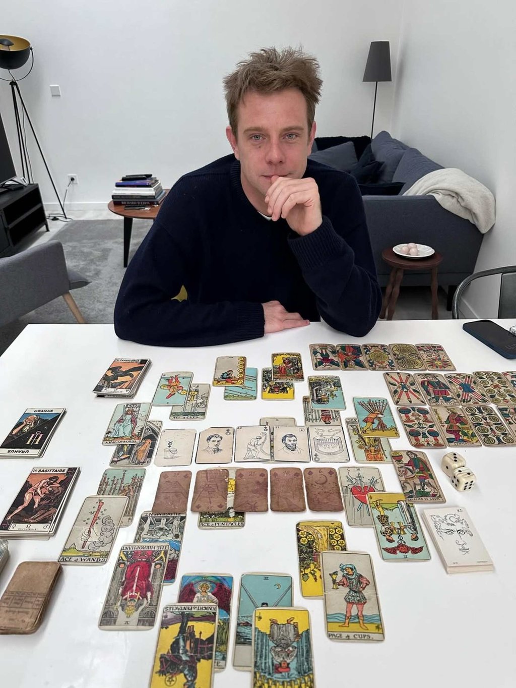 Jonathan Anderson and his tarot spread from his recent reading with Trevor Ballin. Photo: @trevor.ballin/Instagram