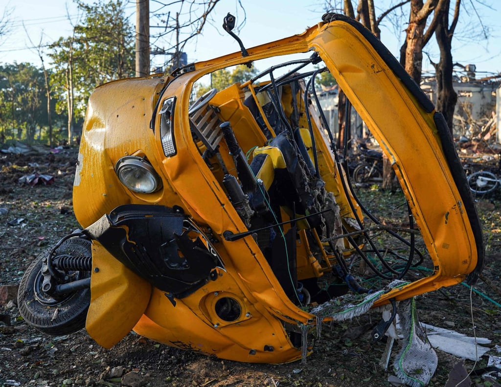 A vehicle lies damaged on the ground after a Myanmar military air strike on a hospital in Mrauk U on December 11. Photo: AFP