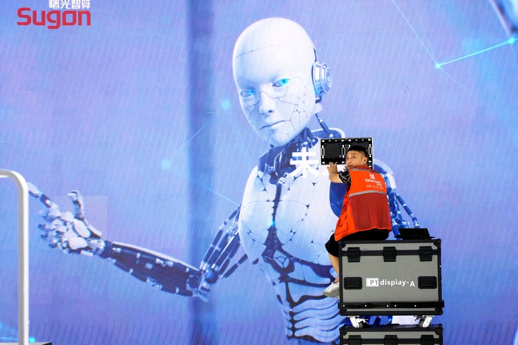 A worker sets up a display at the booth of Sugon ahead of the World artificial intelligence Conference in Shanghai in July 2023. Photo: AP