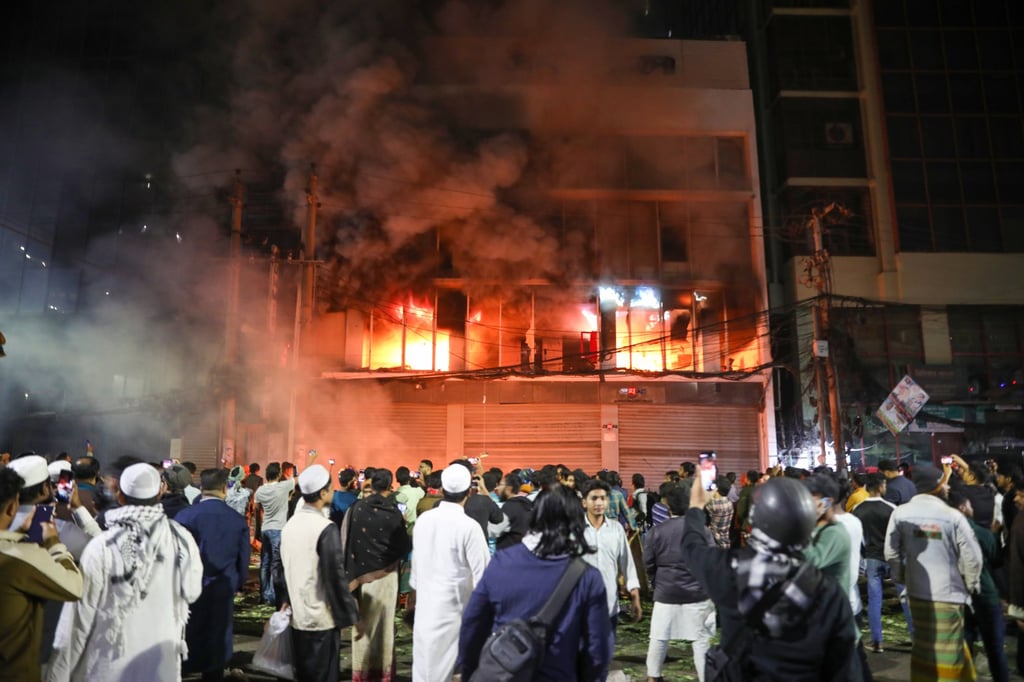 Protesters set fire to a newspaper’s offices early on Friday in Dhaka, Bangladesh. Photo: EPA