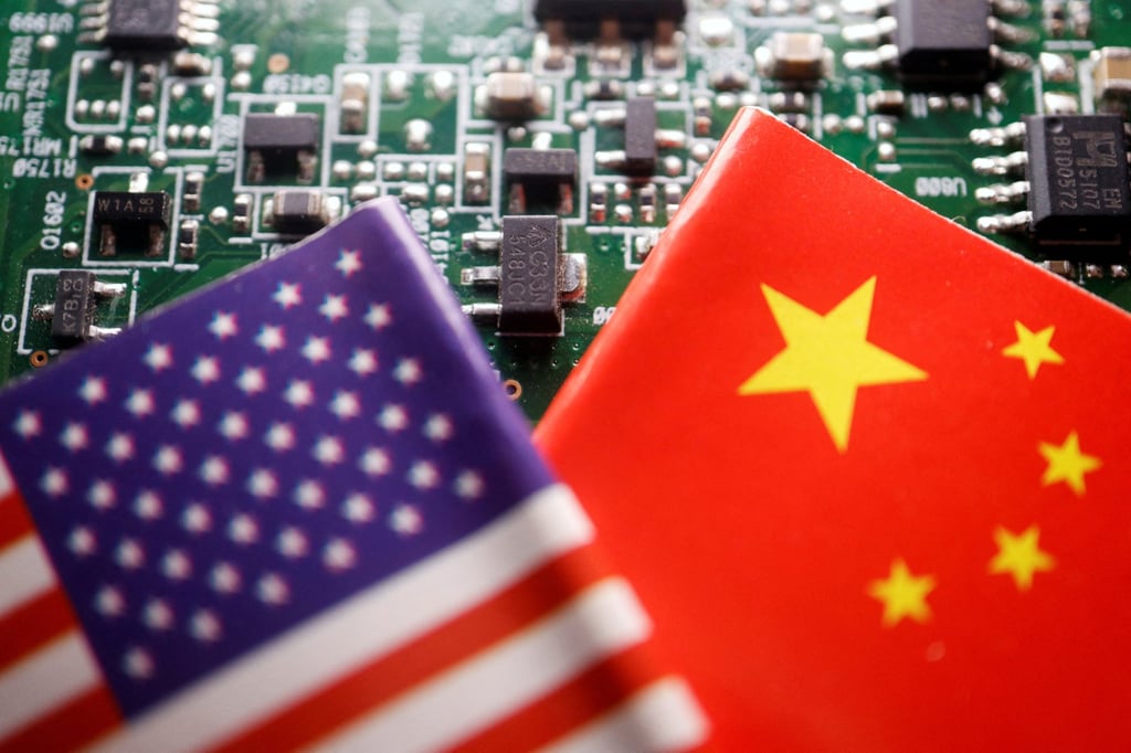 The flags of China and the US are seen on a printed circuit board with semiconductor chips. Photo: Reuters