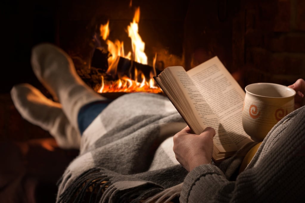 Reading by the fireplace may be cosy, but it could have adverse health effects. Photo: Shutterstock