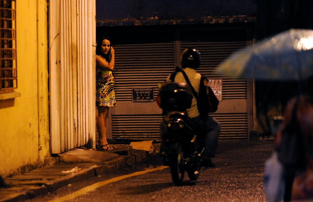 A Malaysian transgender sex worker waits for clients in Chow Kit, Kuala Lumpur, in 2009. Photo: AFP