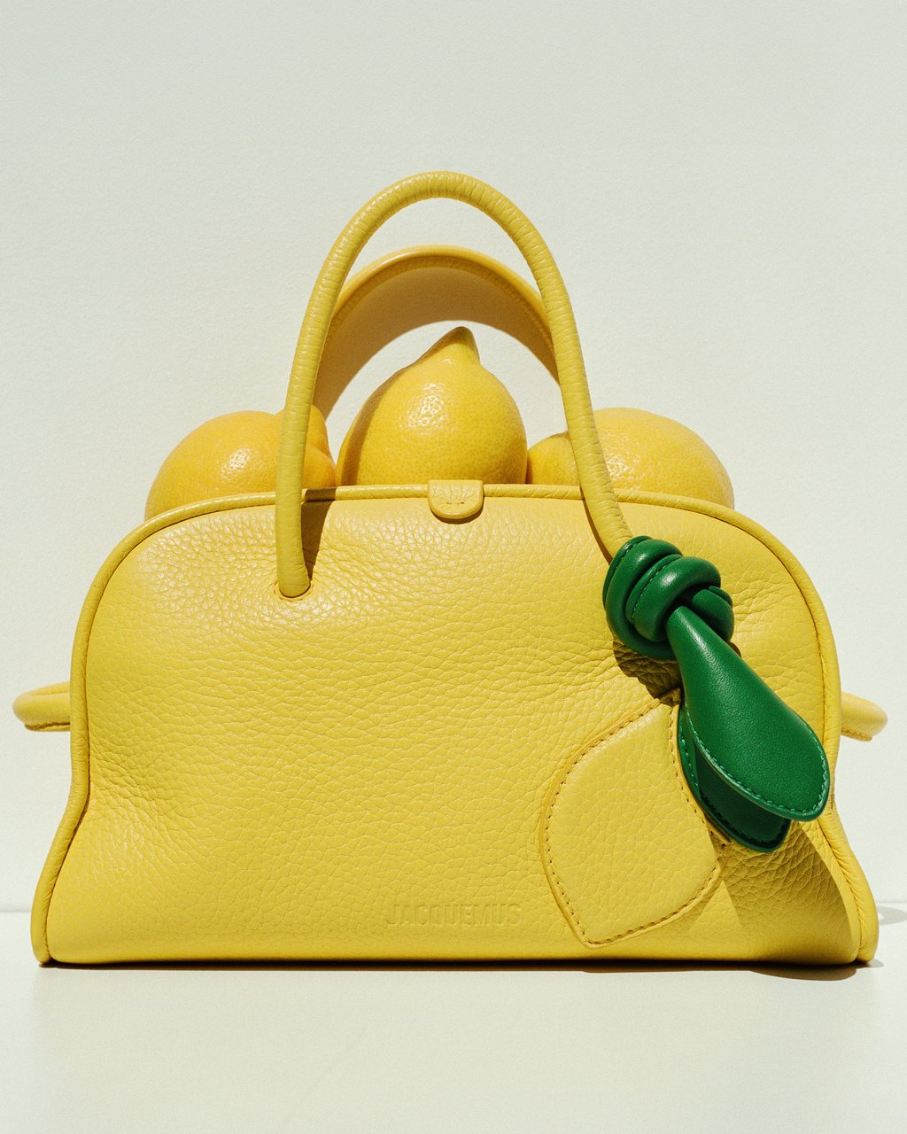 Jacquemus small Turismo bag in lemon yellow with appliqué detailing. Photo: Handout