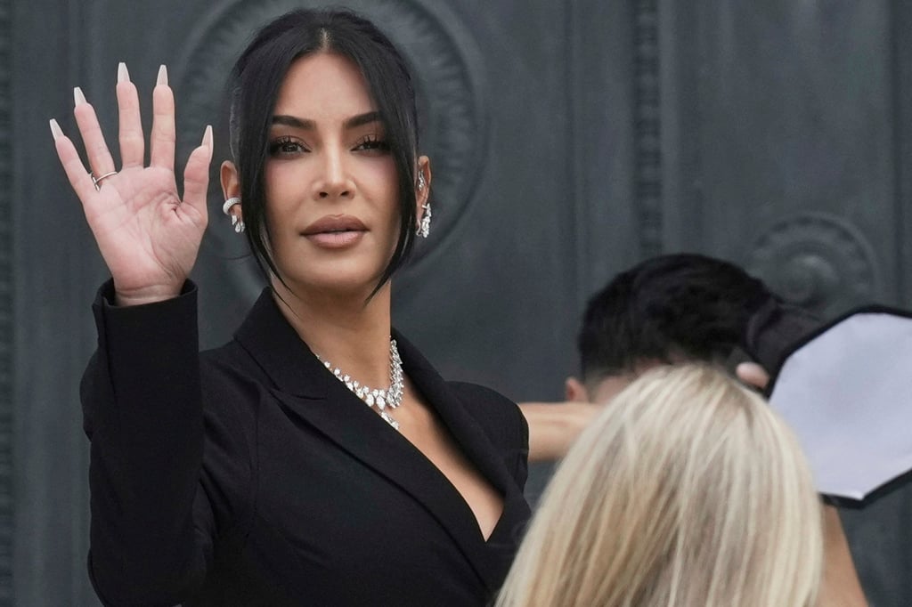Kim Kardashian wore a diamond necklace featuring a 10.13-carat pear-shaped centre stone as well as an ear cuff adorned with 12 pear-shaped diamonds to testify in a Paris courtroom, in May. Photo: AP