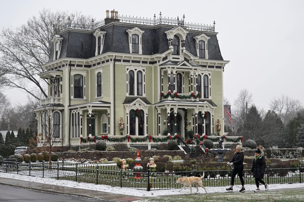 People walk by the Silas W Robbins B & B in Wethersfield, where parts of the Hallmark movie Christmas on Honeysuckle Lane was filmed. Photo: AP