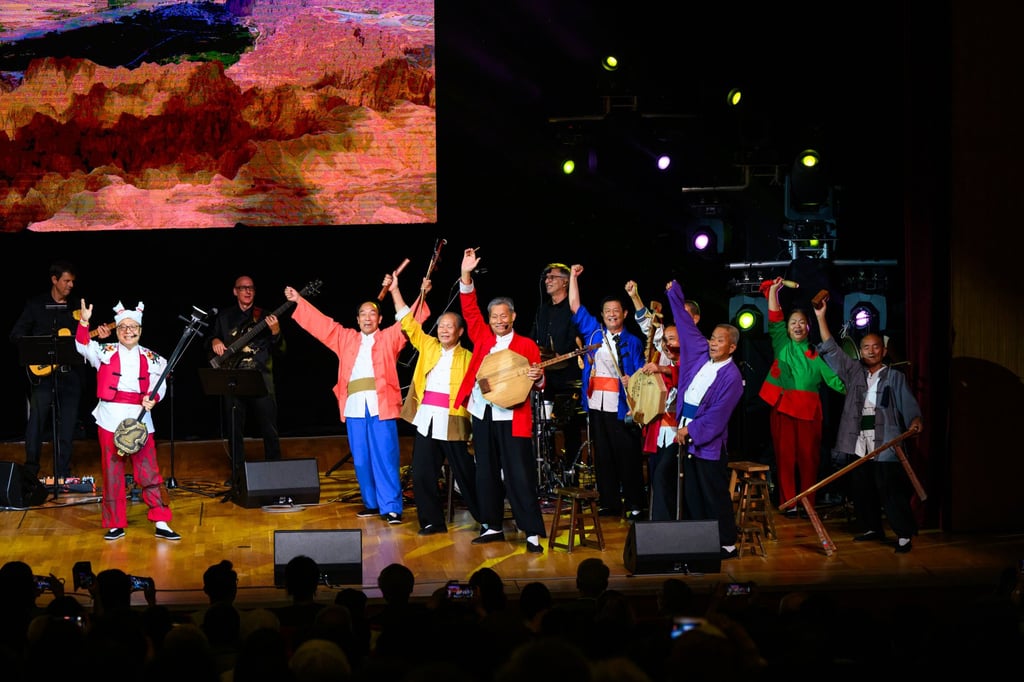 Zhao Taisheng (far left), principal sanxian player with Hong Kong Chinese Orchestra, receives applause after the concert Taisheng and Huayin Lao Qiang: Big Uncle, Second Uncle are All His Uncles.