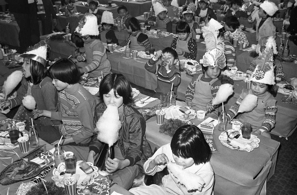 Underprivileged children enjoy a Christmas party at The Excelsior hotel in Causeway Bay in 1977. Photo: SCMP Archives Underprivileged children enjoy a Christmas party at The Excelsior hotel in Causeway Bay in 1977. Photo: SCMP Archives